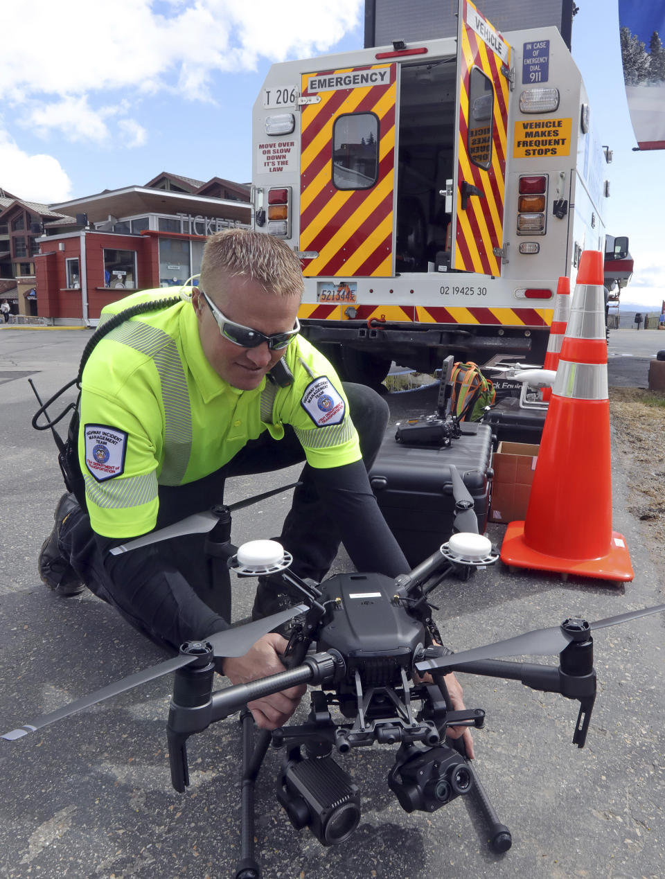 Travis White, Utah Department of Transportation, Highway Incident Management Team, holds a their drone at a drone demo Monday, May 20, 2019, in Park City, Utah. In Utah, drones are hovering near avalanches to watch roaring snow. In North Carolina, they're searching for the nests of endangered birds. In Kansas, they could soon be identifying sick cows through heat signatures. Public transportation agencies are using drones in nearly every state, according to a new survey released on Monday, May 20, 2019 by the American Association of State Highway and Transportation Officials. (AP Photo/Rick Bowmer)