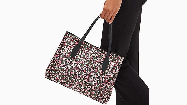 Spring into the season with this floral handbag.