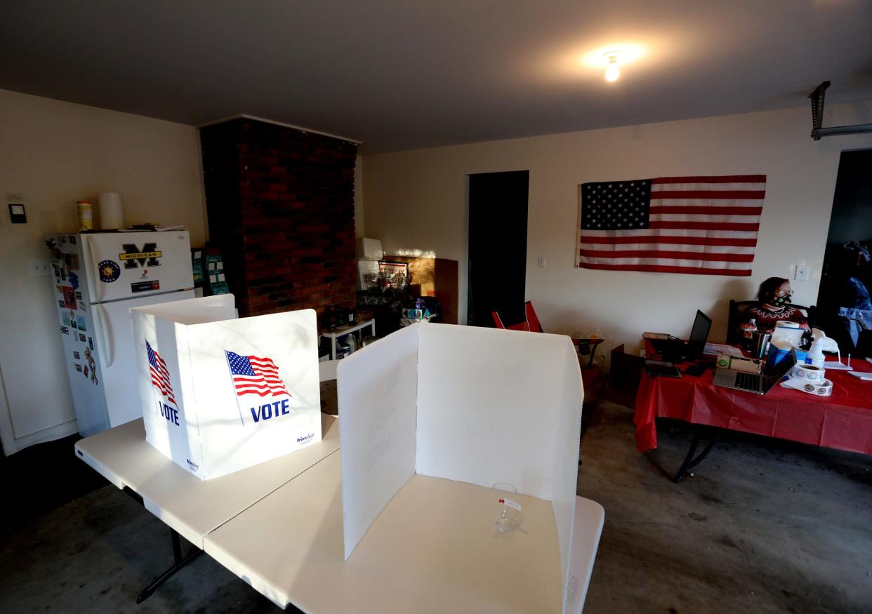 Precinct worker Christine Ingles, of Northville, waits for more voters to show up on Election Day, Tuesday, Nov 3, 2020 at Precinct 1 located inside the garage of Novi Township clerk, Derwood Haines, 58.