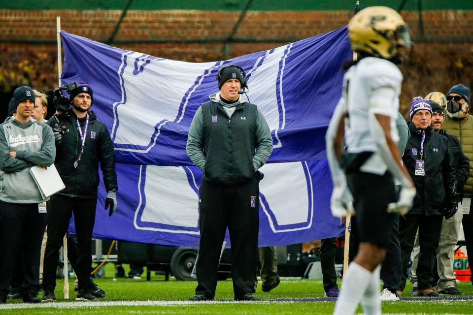 Nov 20, 2021; Chicago, Illinois, USA; Northwestern Wildcats head coach Pat Fitzgerald watches the game against the Purdue Boilermakers during the second quarter at Wrigley Field. Mandatory Credit: Jon Durr-USA TODAY Sports