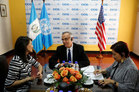 U.S. Ambassador to the United Nations Nikki Haley chats with Commissioner Ivan Velasquez as Attorney General Thelma Aldana listens at the offices of the International Commission Against Impunity in Guatemala (CICIG), in Guatemala City, Guatemala February 28, 2018. REUTERS/Luis Echeverria