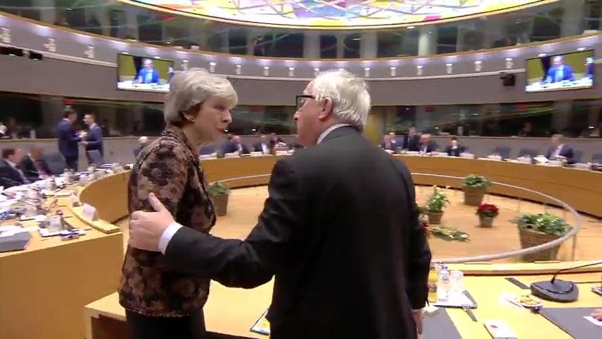 Mr Juncker puts his hand on the Prime Minister