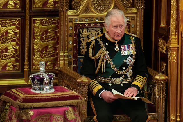 Charles reading the Queen's speech, on behalf of his mother, next to her crown during the State Opening of Parliament, at the Palace of Westminster in London, Tuesday, May 10, 2022.