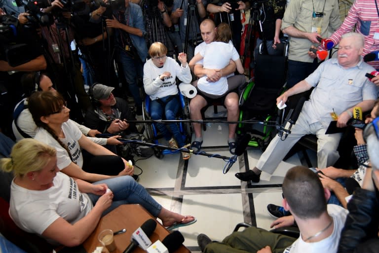 Poland's freedom icon Lech Walesa rallied behind a group of young disabled Poles who have spent 34 days camped out at parliament demanding the right-wing government increase their meagre living allowance