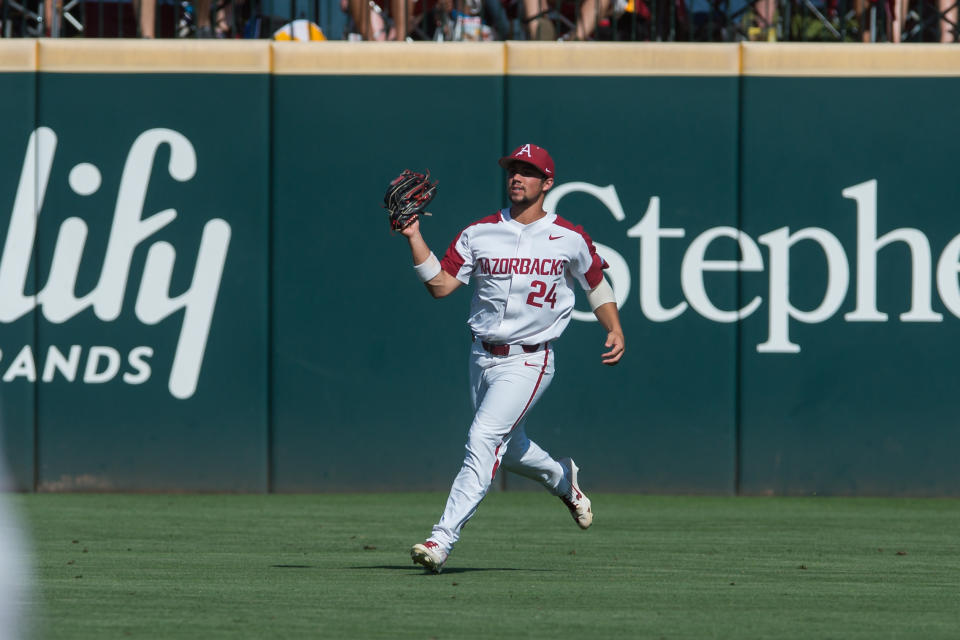 Jun 10, 2019; Fayetteville, AR, USA; Arkansas Razorbacks center fielder Dominic Fletcher (24) makes a catch for an out during the game against the Mississippi Rebels at Baum-Walker Stadium. Mandatory Credit: Brett Rojo-USA TODAY Sports