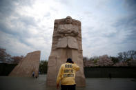 <p>An attendee is seen during a silent march and rally on the National Mall to mark the 50th anniversary of the assassination of civil rights leader Rev. Martin Luther King Jr. in Washington, April 4, 2018. (Photo: Eric Thayer/Reuters) </p>