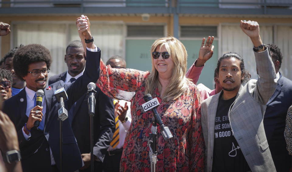 Justin Pearson, Gloria Johnson and Justin Jones raise their fists in solidarity at a rally to support of Pearson on Wednesday, April 12, 2023 in Memphis, Tenn. A Shelby County Board of Commissioners committee approved a resolution Wednesday morning that clears the way for an afternoon vote by the full commission on whether Pearson will get his seat back. (Patrick Lantrip/Daily Memphian via AP)