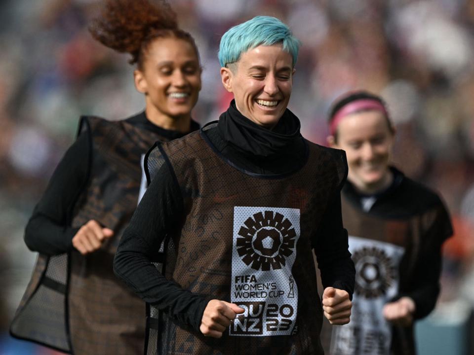 Megan Rapinoe (center) leads a group of reserves in warm-ups during a 2023 World Cup match.