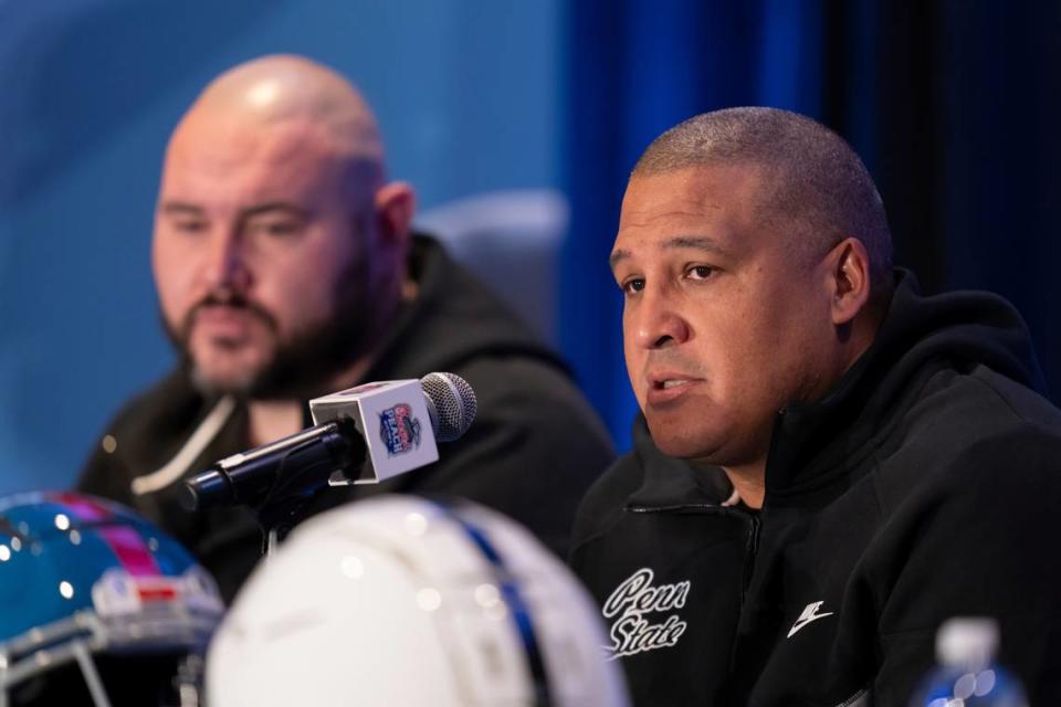 Penn State co-offensive coordinators Ja’Juan Seider (foreground) and Ty Howle address the media Wednesday during a news conference prior to the 2023 Chick-fil-A Peach Bowl in Atlanta. Penn State will face Ole Miss in the college football bowl game on Saturday.