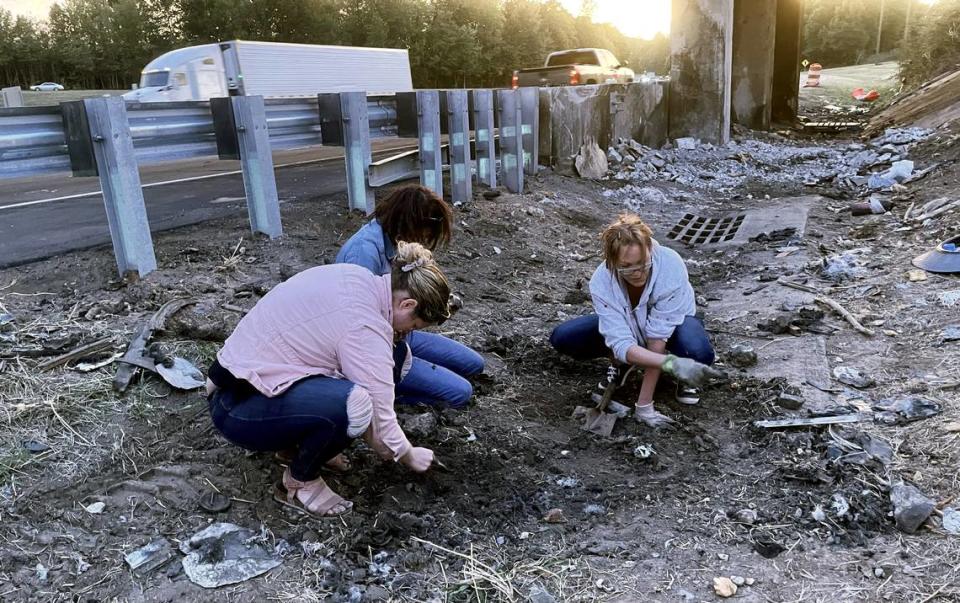 Alyssa Taylor’s mom Krista Taylor and her aunts, Lori Taylor and Sabrina Taylor sort through rocks and debris on Sept. 29, 2022, at the site of a fatal crash at Exit 165 on Interstate 85 in Hillsborough, NC. The family has not heard from Alyssa since Sept. 13, 2022.