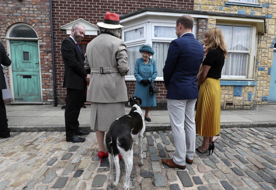 Queen Elizabeth II meets actors and members of the production team during a visit to the set of Coronation Street at the ITV Studios, Media City UK, Manchester. Picture date: Thursday July 8, 2021.