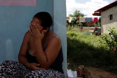 Jennifer Vivas, mother of Eliannys Vivas, who died from diphtheria, cries at the front porch of her home in Pariaguan, Venezuela January 26, 2017. REUTERS/Marco Bello