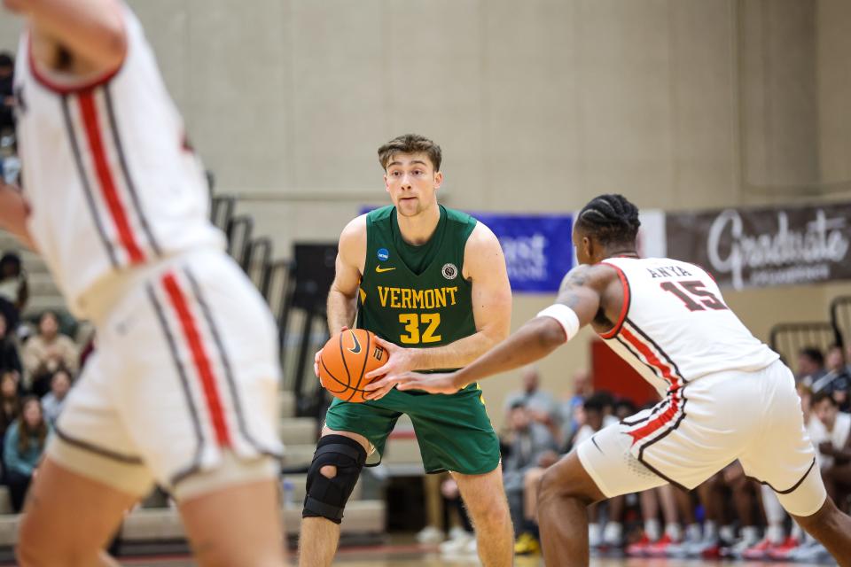 Nick Fiorillo looks to pass during Vermont's 71-70 win over host Brown on Tuesday, Jan. 2, 2024.