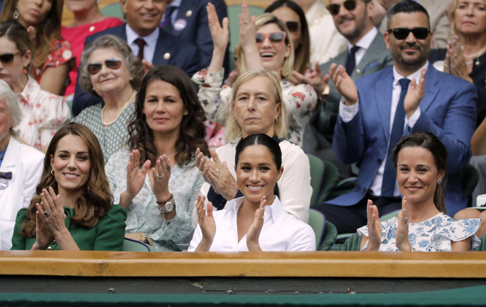 The Duchess of Cambridge and The Duchess of Sussex with Pippa Matthews during the women's singles final on day twelve of the Wimbledon Championships at the All England Lawn Tennis and Croquet Club, Wimbledon.