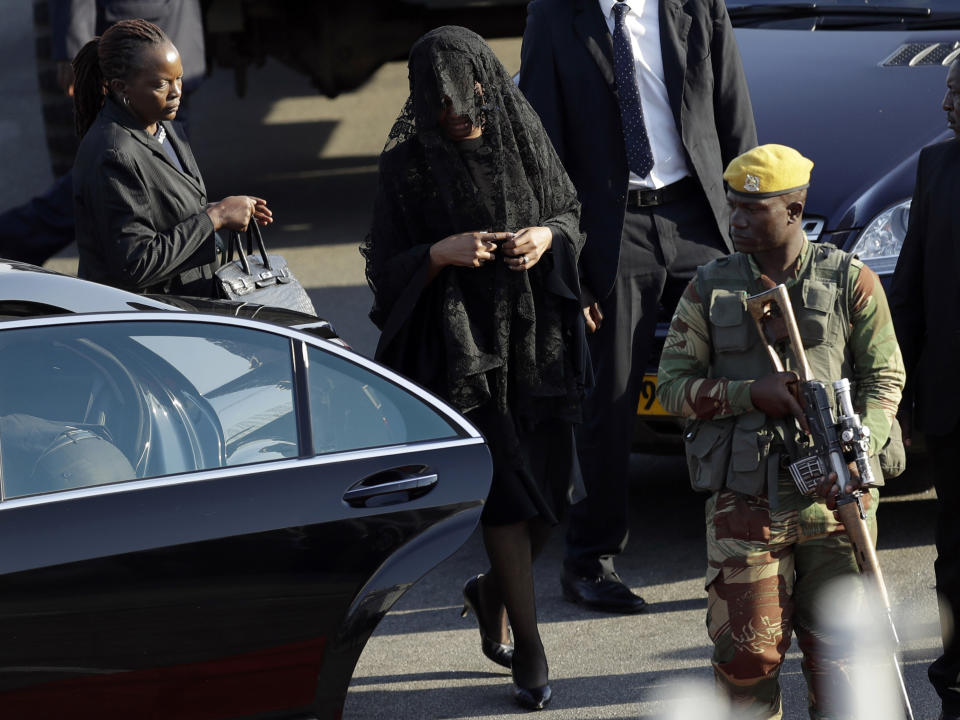 Grace Mugabe, second from left, wife of former President Robert Mugabe, attends the arrival ceremony of his remains at Robert Gabriel Mugabe International Airport in Harare, Zimbabwe, Wednesday, Sept. 11, 2019. Mugabe died Friday in a Singapore hospital at age 95. (AP Photo/Themba Hadebe)