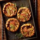 <p>Prepared pie crusts make assembling these free-form tarts quick and fast. Feel free to swap in your favorite jam, meat or cheese. Serve with a simple green salad for an easy brunch or light dinner.</p>