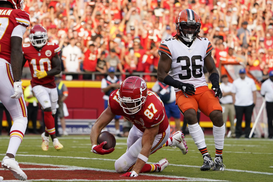 Kansas City Chiefs tight end Travis Kelce (87) scores past Cleveland Browns safety M.J. Stewart Jr. (36) during the second half of an NFL football game Sunday, Sept. 12, 2021, in Kansas City, Mo. (AP Photo/Ed Zurga)