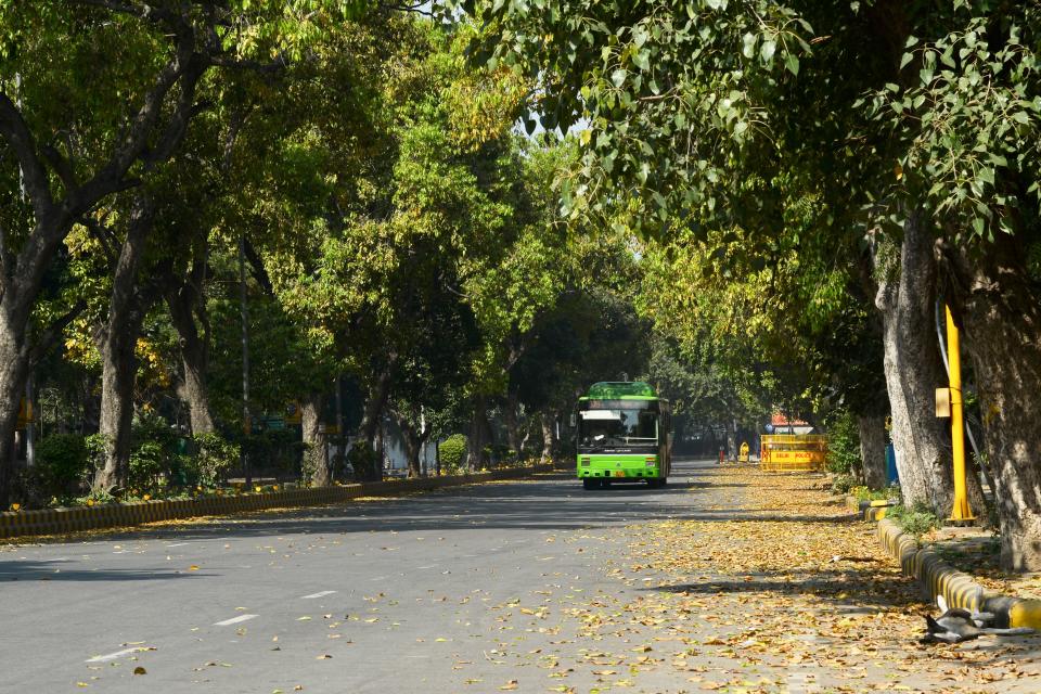 A bus moves through a deserted road during a one-day Janata (civil) curfew imposed as a preventive measure against the COVID-19 coronavirus, in New Delhi on March 22, 2020. - Nearly one billion people around the world were confined to their homes, as the coronavirus death toll crossed 13,000 and factories were shut in worst-hit Italy after another single-day fatalities record. (Photo by Sajjad HUSSAIN / AFP) (Photo by SAJJAD HUSSAIN/AFP via Getty Images)