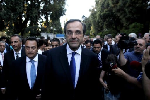 Greece's new Prime Minister Antonis Samaras (C) is seen in Athens on June 21, 2012. Samaras must face a crucial audit by Greece's creditors this week and may be tempted to push a change of rescue terms more in line with what was recently offered Spain