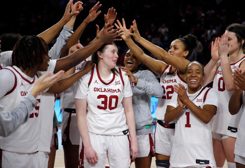 Oklahoma's Taylor Robertson (30) celebrates her 3-point record with teammates following the women's college game between the University of Oklahoma Sooners and the TCU Horned Toads a the Lloyd Noble Center in Norman, Okla., Tuesday, Jan.31, 2023. 