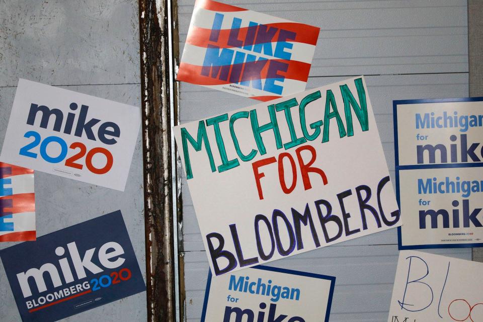 Signs are posted on a wall at a rally site where Democratic presidential candidate Mike Bloomberg held a campaign rally on February 4, 2020 in Detroit, Michigan.