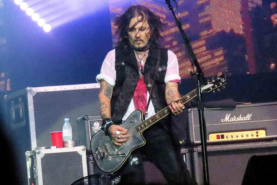 <p>KCS Presse / MEGA</p> Johnny Depp performing in Paris on June 25, 2023.