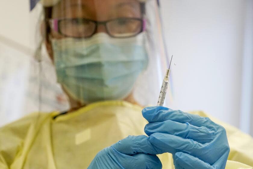 FILE - A physician assistant prepares a syringe with the Mpox vaccine for a patient at a vaccination clinic in New York on Friday, Aug. 19, 2022. Mpox is no longer the exploding health crisis that it appeared to be less than six months ago. So who deserves the credit for controlling the U.S. outbreak? It's an unsettled question, but experts cite a combination of factors.Some commend public health officials.(AP Photo/Mary Altaffer, File)