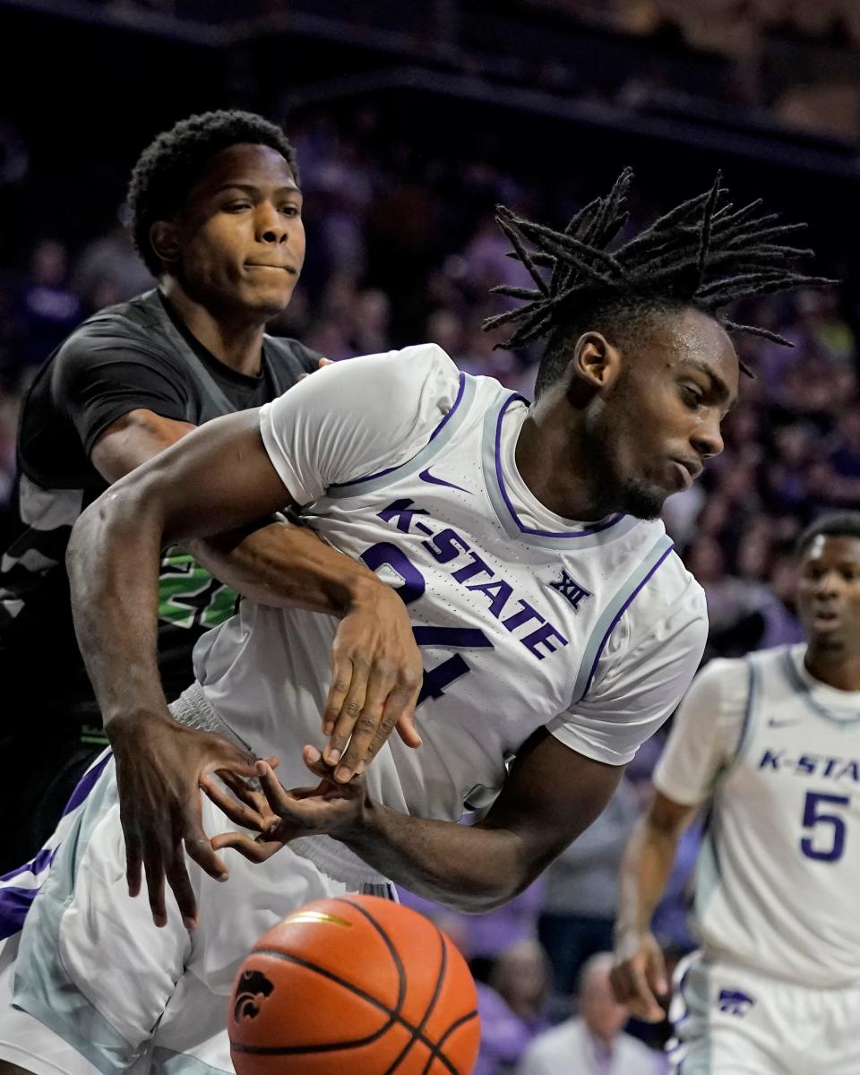 Chicago State's Cameron Jernigan, left, knocks the ball away from Kansas State forward Arthur Kaluma (24) during Tuesday's game at Bramlage Coliseum. Kaluma and the Wildcats open Big 12 play at home Saturday against UCF.