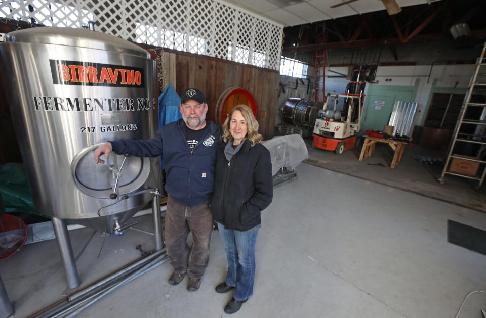 Greg Borden, a retired Rochester firefighter, with wife Kate in their Engine 14 Brewery in Naples Friday, March 5, 2021. 