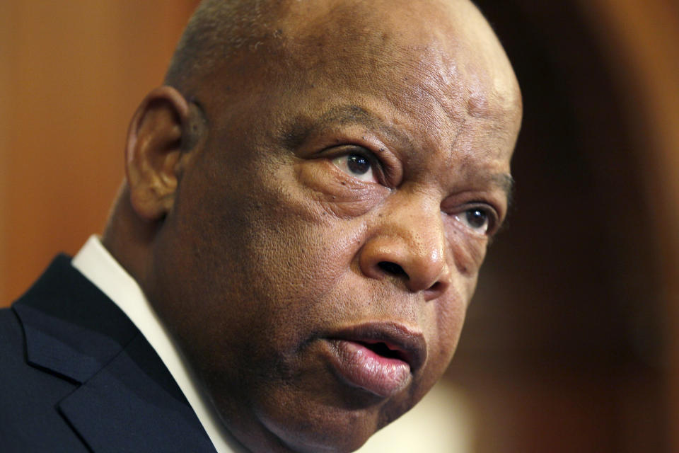 FILE - This June 16, 2010 file photo, Rep. John Lewis, D-Ga., participates in a ceremony to unveil two plaques recognizing the contributions of enslaved African Americans in the construction of the United States Capitol on Capitol Hill in Washington. Lewis, who carried the struggle against racial discrimination from Southern battlegrounds of the 1960s to the halls of Congress, has died. House Speaker Nancy Pelosi confirmed his passing late Friday, July 17, 2020. (AP Photo/Carolyn Kaster, File)