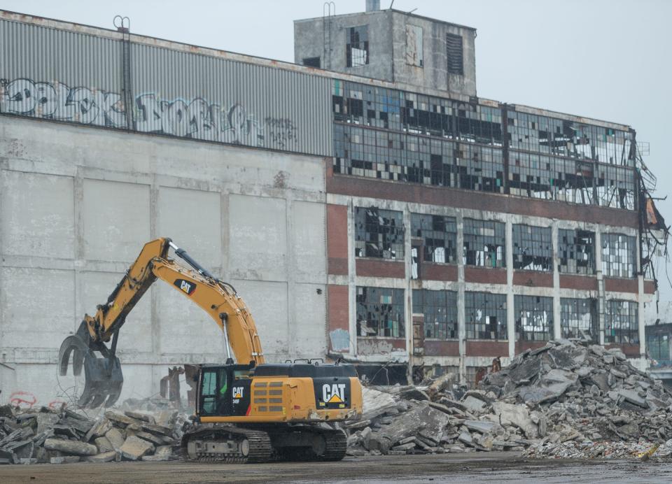 Crew members from Inner City Contracting work on demolition at the vacant Cadillac Stamping Plant in Detroit on June 2, 2021.