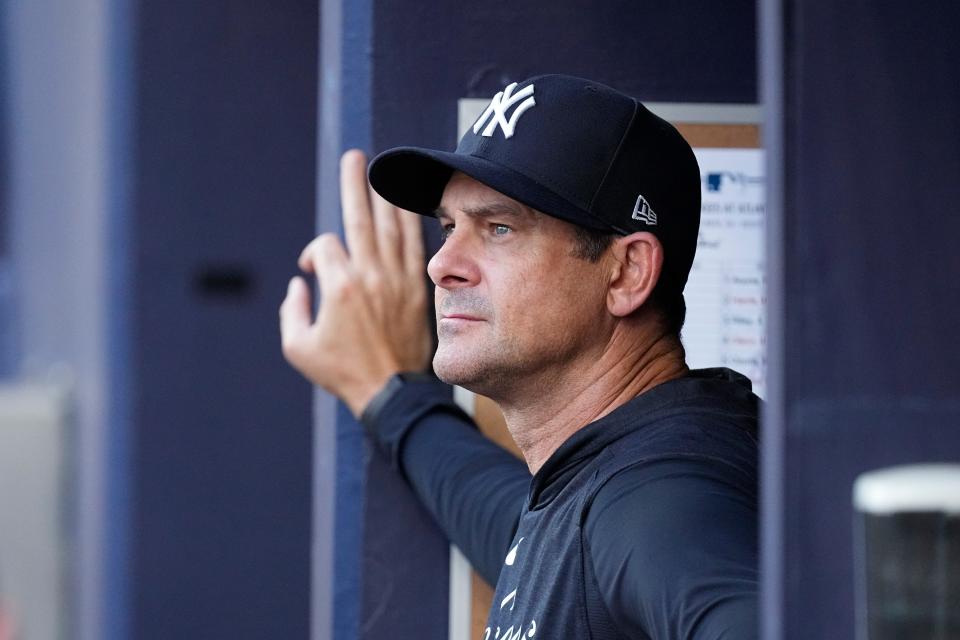 New York Yankees manager Aaron Boone waits for the team's baseball game against the Atlanta Braves to begin, Wednesday, Aug. 16, 2023, in Atlanta. (AP Photo/John Bazemore)