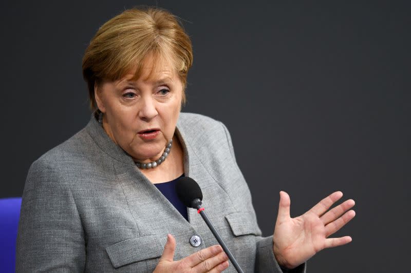 FILE PHOTO: German Chancellor Angela Merkel attends a session of lower house of parliament, the Bundestag, in Berlin