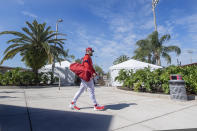 Philadelphia Phillies' Bryce Harper walks to batting practice during spring training baseball practice in Clearwater, Fla., Thursday, Feb. 25, 2021. (Jose F. Moreno/The Philadelphia Inquirer via AP)