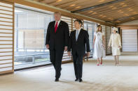 FILE - In this May 27, 2019, file photo released by Imperial Household Agency of Japan, U.S. President Donald Trump, left, talks with Japan's Emperor Naruhito while first lady Melania Trump talks with Empress Masako, right, during their state call at the Imperial Palace in Tokyo. Japan is fully in a festive mood as Emperor Naruhito will perform his main ceremony on Tuesday, Oct. 22, proclaiming his ascension to the Chrysanthemum Throne. Naruhito, 59, has already been a fully-fledged emperor and received U.S. President Trump and other foreign dignitaries since succeeding the throne from his abdicated father Akihito and a new imperial era of “Reiwa” began in May. (Imperial Household Agency of Japan via AP, File)