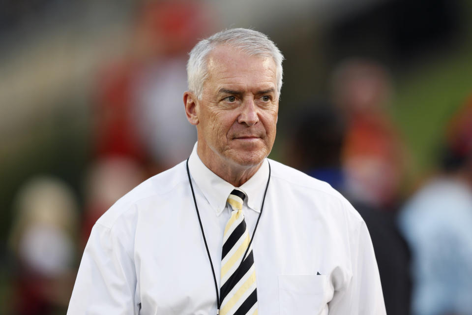 FILE - In this Sept. 14, 2019, file photo, University of Iowa Athletic Director Gary Barta walks on the field before an NCAA college football game between Iowa State and Iowa, in Ames, Iowa. Barta held a news conference Monday, June 15, 2020, where he outlined a plan for the athletic department to improve and build on its diversity and inclusion task force. A number of Iowa assistant coaches are alleged to have mistreated and belittled African American football players.(AP Photo/Charlie Neibergall, File)