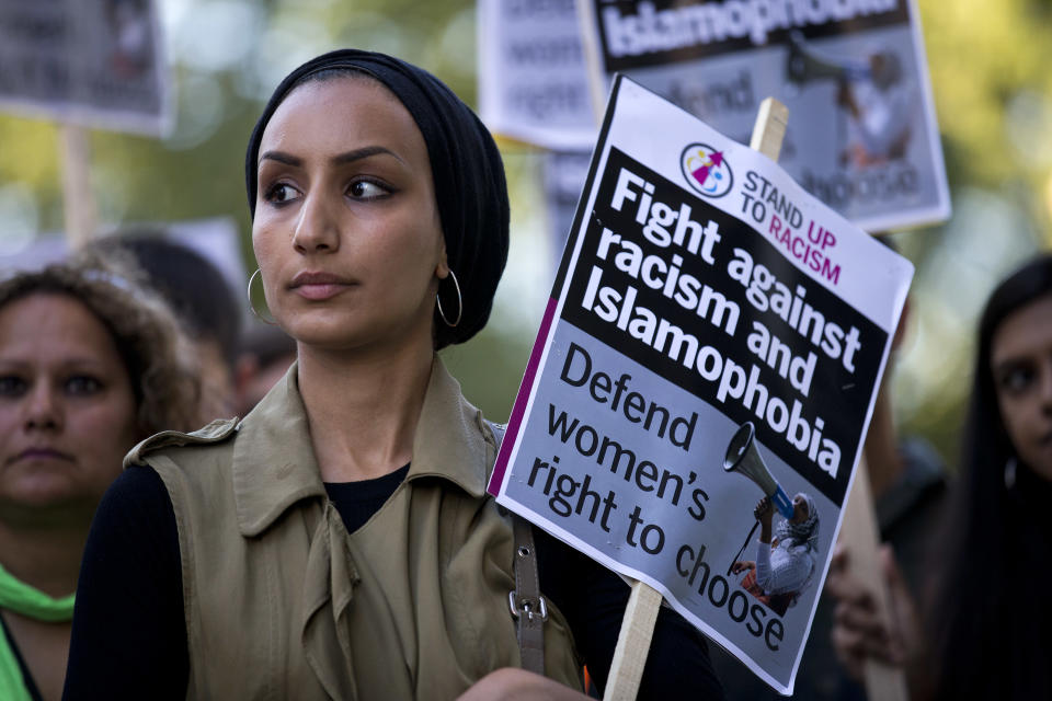 A woman joins a demonstration organized by 'Stand up to Racism' outside the French Embassy in London on Aug.&nbsp;26, 2016, against the burkini ban on French beaches.