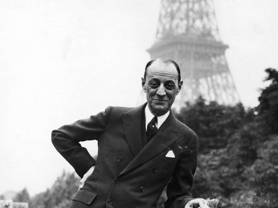 Isidor Jesse Straus arrived in Paris to take up his post as American Ambassador to France. He is posing in the gardens of the residence of the embassy in Paris, France on May 31, 1933. In the background is the Eiffel Tower.