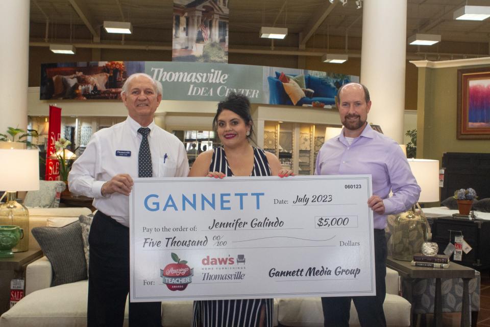 El Paso-area school counselor Jennifer Galindo is presented the national Amazing Teacher award for the month of July, including a $5,000 prize, at the Thomasville Home Furnishing store in East El Paso on Aug. 2.