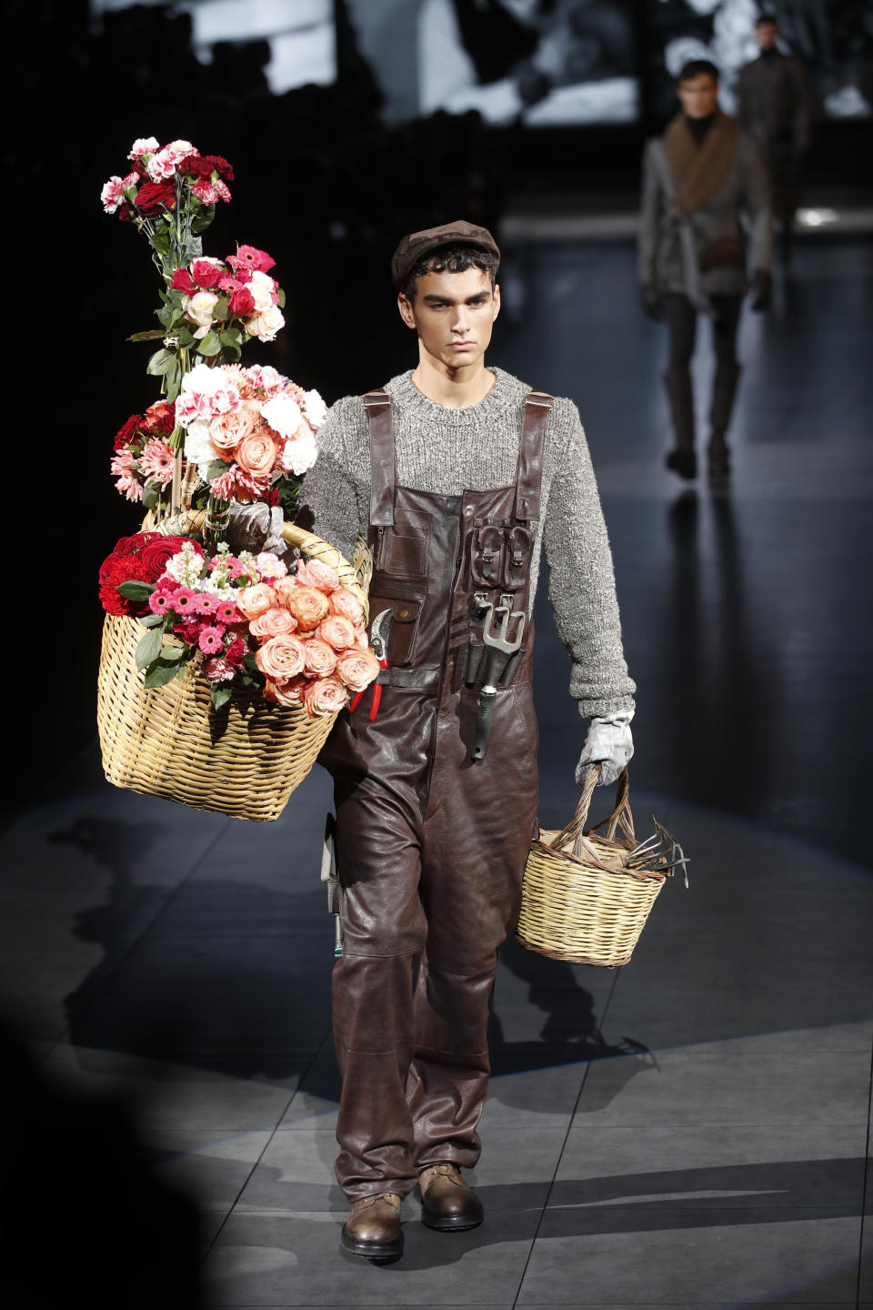 A model wears a creation as part of the Dolce & Gabbana men's Fall-Winter 2020/21 collection, that was presented in Milan, Italy, Saturday, Jan. 11, 2020. (AP Photo/Antonio Calanni)