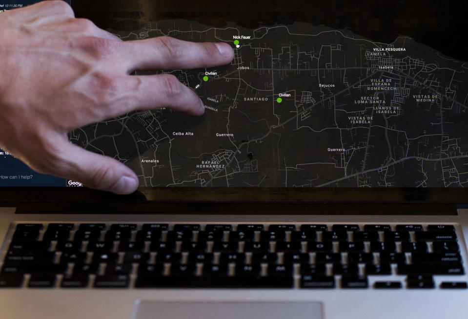 This March 13, 2019 photo shows information relayed through the Clusterduck system which provides a low-frequency Wi-Fi connection in the event of a disaster, on Project OWL team leader Bryan Knouse's computer, during a field test in Isabela, Puerto Rico. Every couple of minutes, the computer dinged with messages that included names, location and details of the roving group that popped up on a map with messages such as "Help me please!" and "NEED WATER!!!" (AP Photo/Carlos Giusti)