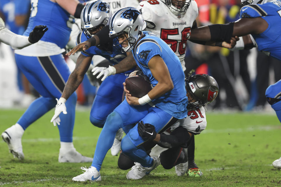 Carolina Panthers quarterback Bryce Young is tackled by Tampa Bay Buccaneers safety Antoine Winfield Jr. during the second half of an NFL football game Sunday, Dec. 3, 2023, in Tampa, Fla. (AP Photo/Mark LoMoglio)