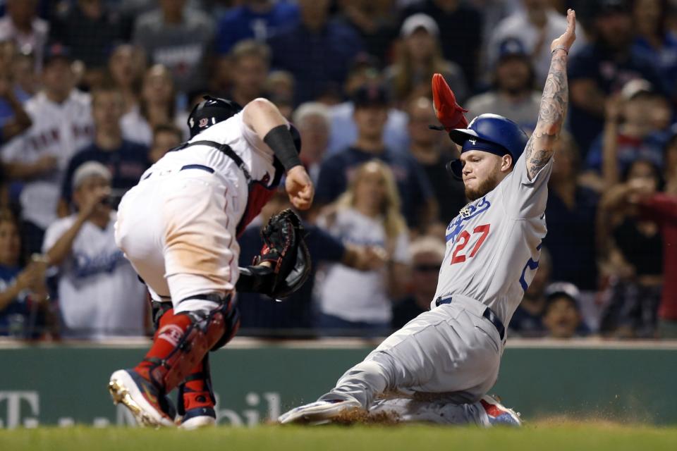 Boston Red Sox's Christian Vazquez tags out Los Angeles Dodgers' Alex Verdugo (27) at home plate during the 11th inning of a baseball game in Boston, Sunday, July 14, 2019. (AP Photo/Michael Dwyer)