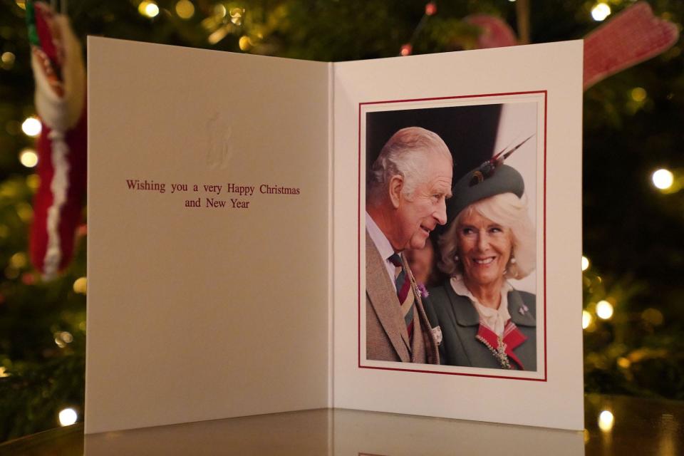 The 2022 Christmas card of King Charles III and the Queen Consort in front of a Christmas tree in Clarence House on December 11, 2022.