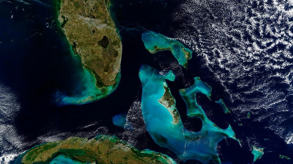 A satellite image of Florida (top left), the Bahamas (right) and Cuba (bottom left). (Photo: Stocktrek Images via Getty Images)