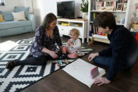 Julia Scharle and her husband play with their daughter in Budakeszi, a western suburb of Budapest, Hungary, February 17, 2019. Picture taken February 17, 2019. REUTERS/Tamas Kaszas