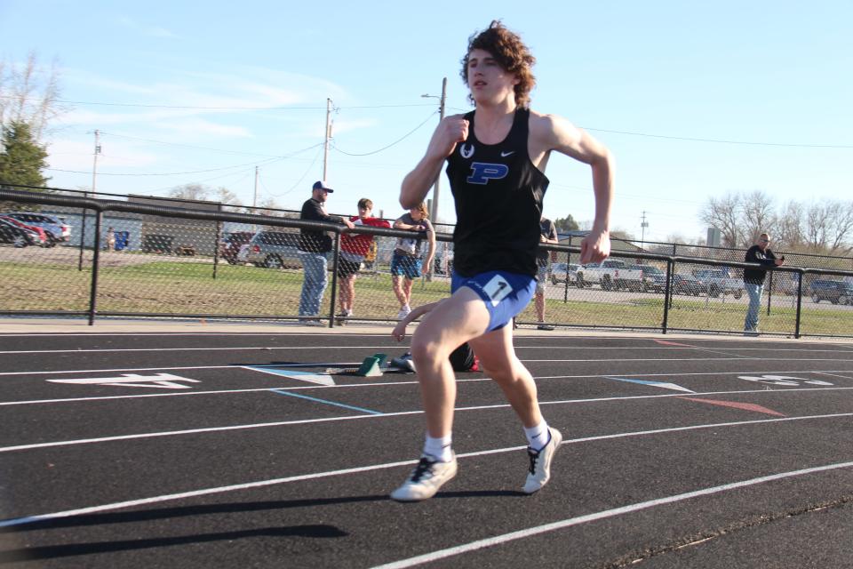 Geren Kenney takes off at the start of the 400-meter dash during the Davis Relays on Thursday, April 13, 2023, at Jim Kaufman Memorial Track in Perry.