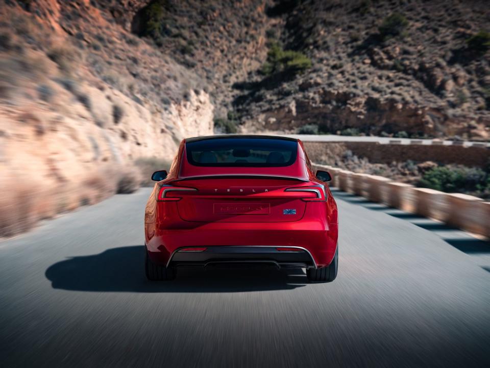 a red sports car on a road