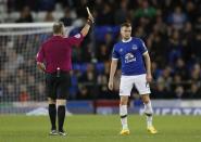 Britain Football Soccer - Everton v Crystal Palace - Premier League - Goodison Park - 30/9/16 Everton's Tom Cleverley is shown a yellow card by referee Jonathan Moss Action Images via Reuters / Carl Recine Livepic