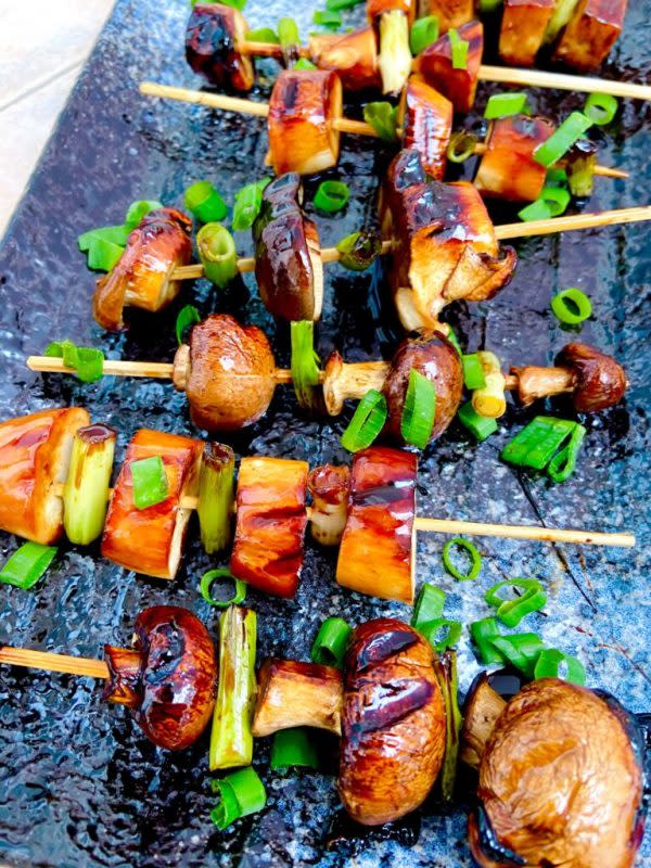 <p>Yum Vegan Lunch Ideas</p><p>This vegan yakitori is the perfect vegan bbq option. It's completely flavorful, covered in teriyaki.</p><p><strong>Get the Recipe: </strong><a href="https://yumveganlunchideas.com/vegan-yakitori-recipe-vegan-bbq/" rel="nofollow noopener" target="_blank" data-ylk="slk:Mushroom and Tofu Yakitori;elm:context_link;itc:0;sec:content-canvas" class="link ">Mushroom and Tofu Yakitori</a></p>